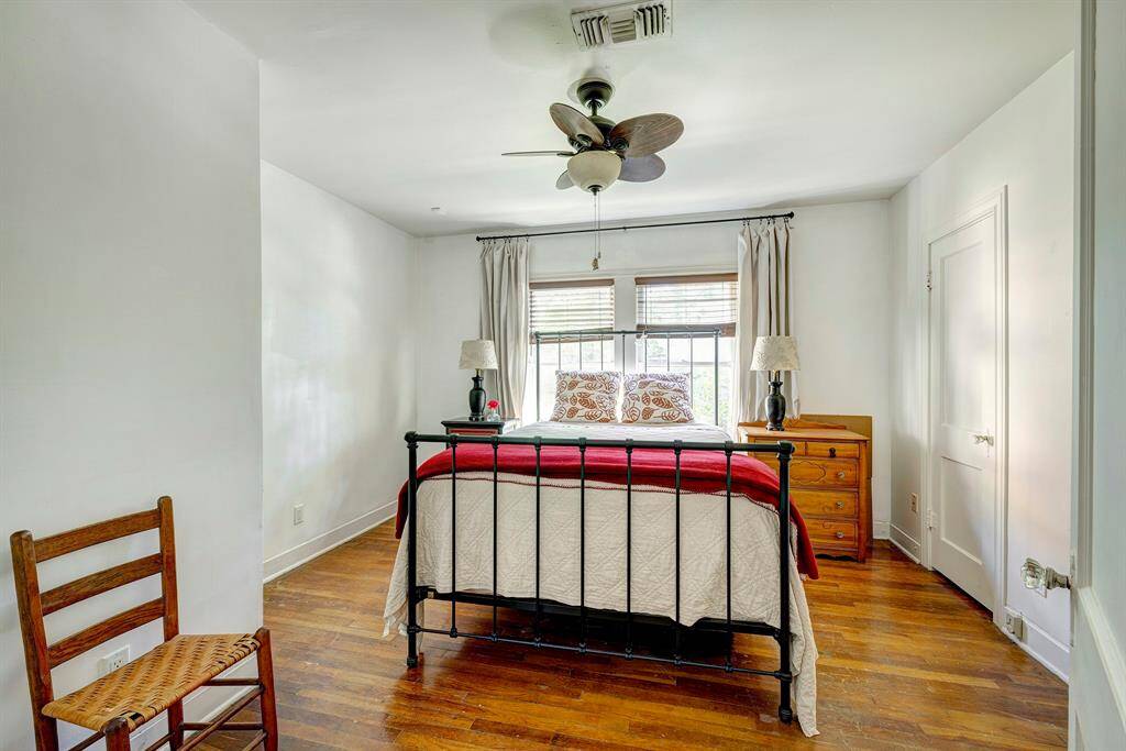 Secondary bedroom with hardwoods, ceiling fan