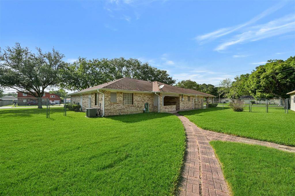 paved sidewalks to outer buildings, fenced yard