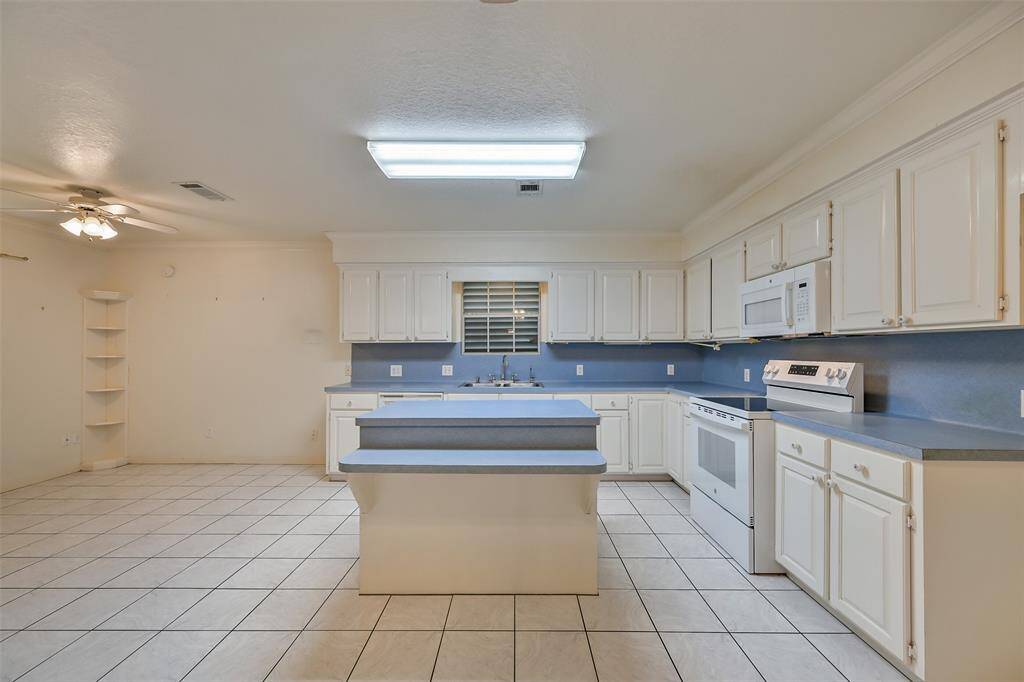 Kitchen with breakfast nook, and seating around island