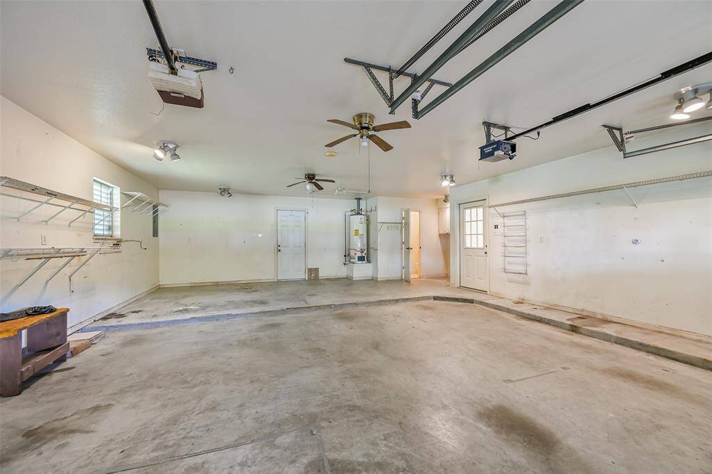 Oversized attached garage with bathroom, washer, dryer hookups.