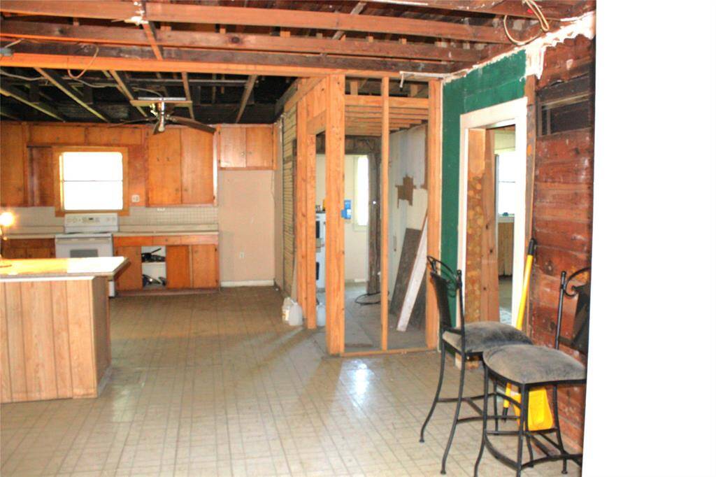 Looking into breakfast or dining area and kitchen.