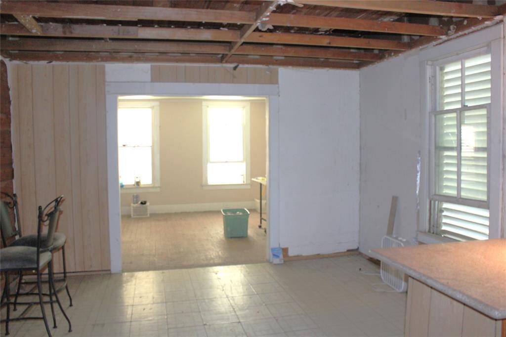 Looking from kitchen into breakfast or dining area.