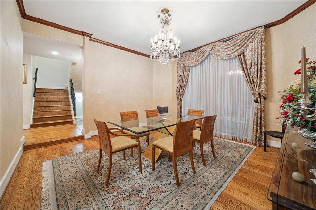 The formal dining room flanks the entry hallway of the home.