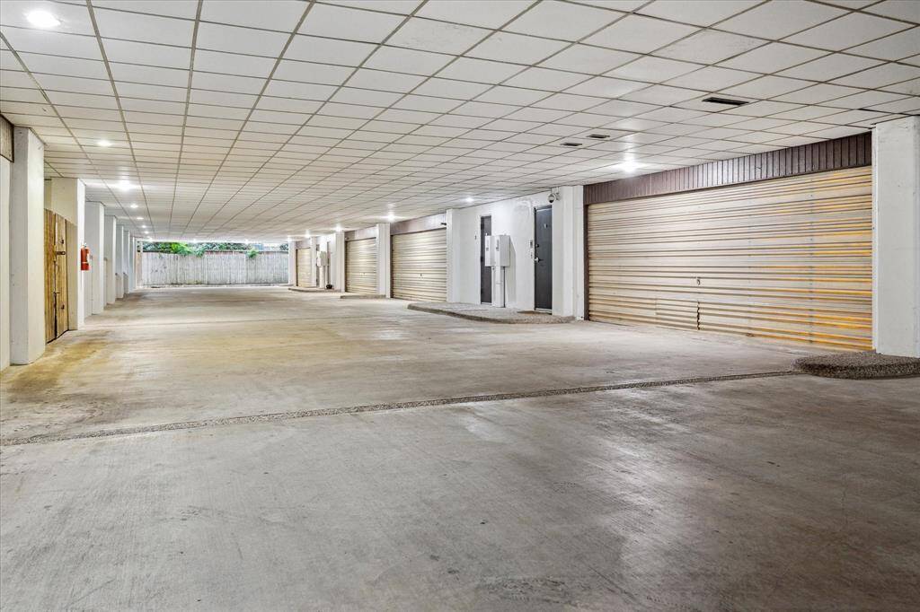 The private and secure garage access under the home that is privately owned by the HOA. The property has its own private 2-Car attached oversized garage with built-in storage