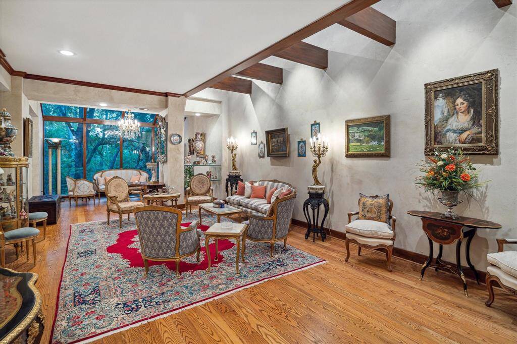 The formal living and entertainment areas feature a well-positioned wet bar and high ceilings with skylights.