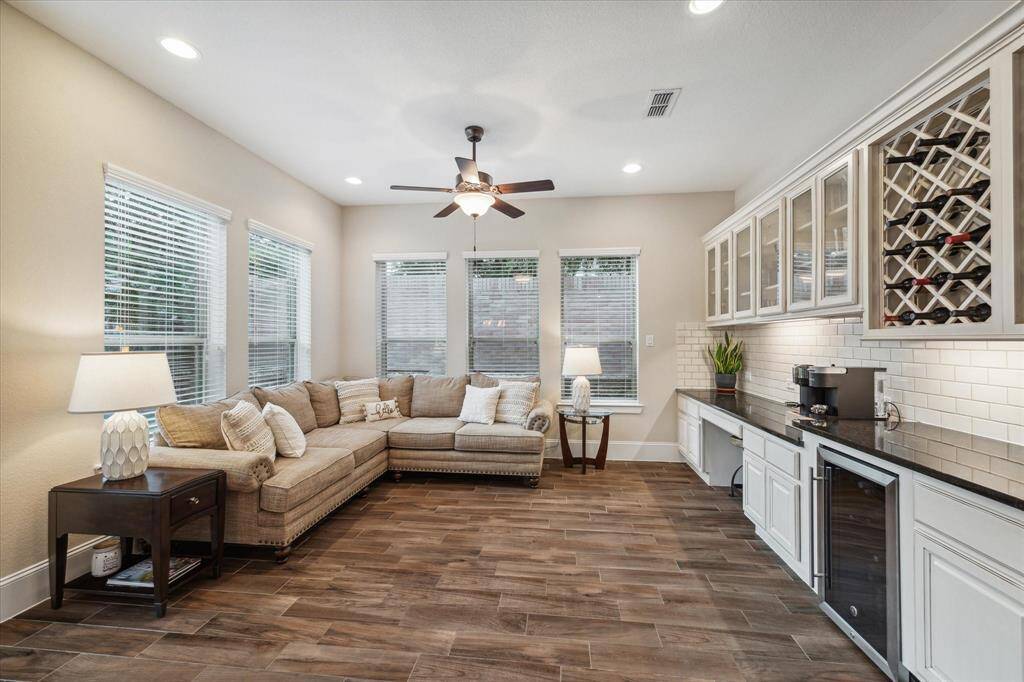 Sunroom, Built ins, wine fridge, wine rack, and desk nook are amongst the many fine details that this home has to offer!