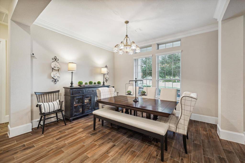 A formal dining with custom lighting right off the front entrance!