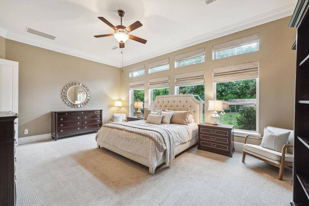 FABULOUS & Massive Primary Suite with upgraded textured carpet, tons of natural light with beautiful views of the backyard!