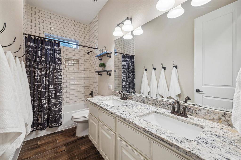 3rd bathroom located downstairs in between the 3rd and 4th bedrooms