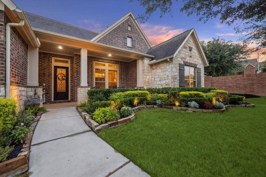 Fabulous landscaping meticulously kept surrounding this entire lot!