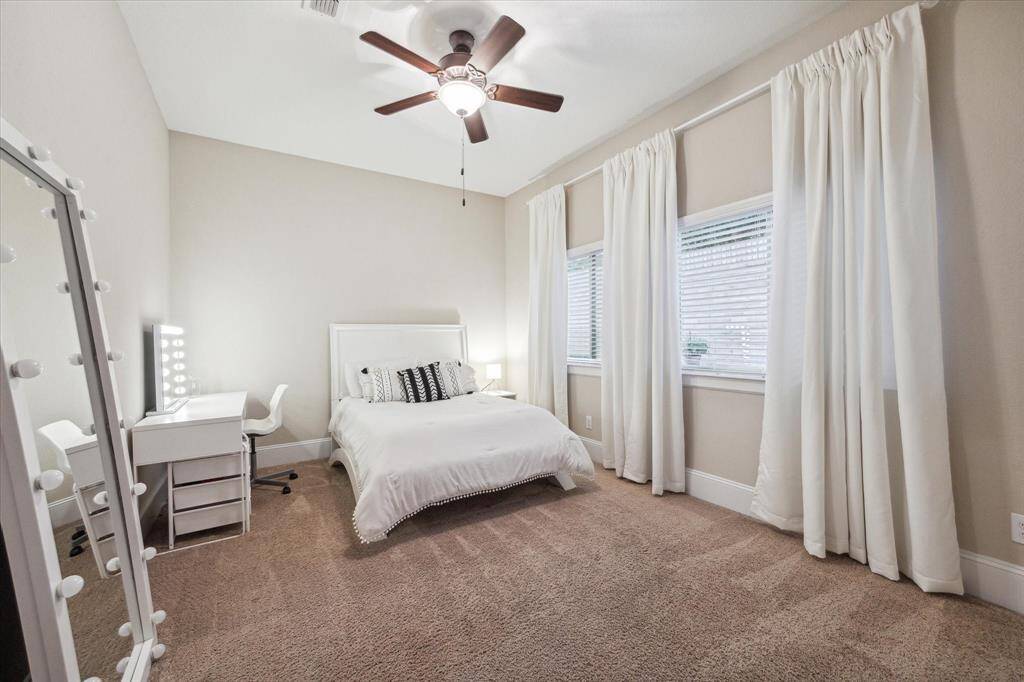 4th Bedroom located downstairs...the sellers made sure to build a home where every bedroom and their closets had an abundance of space!