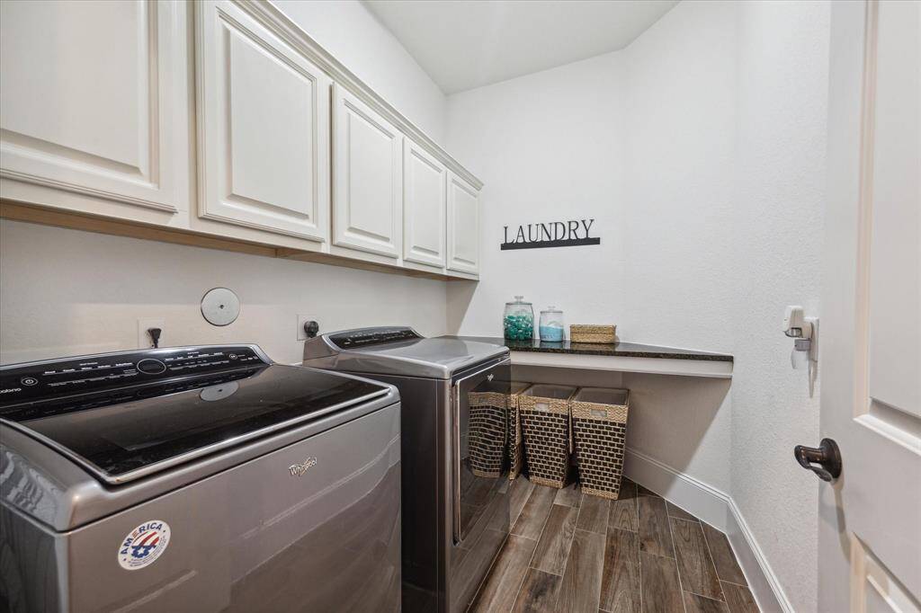 Laundry Room with plenty of cabinet and folding space