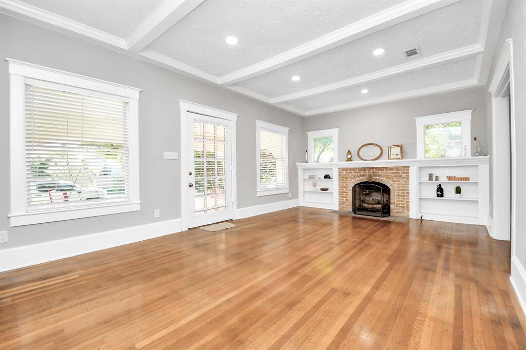 Charming 1920's bungalow, bathed in natural light from abundant windows, exuding a warm and inviting ambiance.