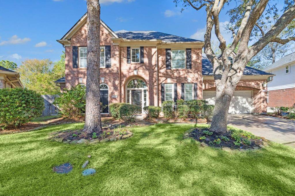 This is a two-story brick home has never flooded with a well-manicured lawn, mature trees, and an attached three-car garage. The house features arched windows and a welcoming entryway located on a cul-de-sac and no neighbors behind.
