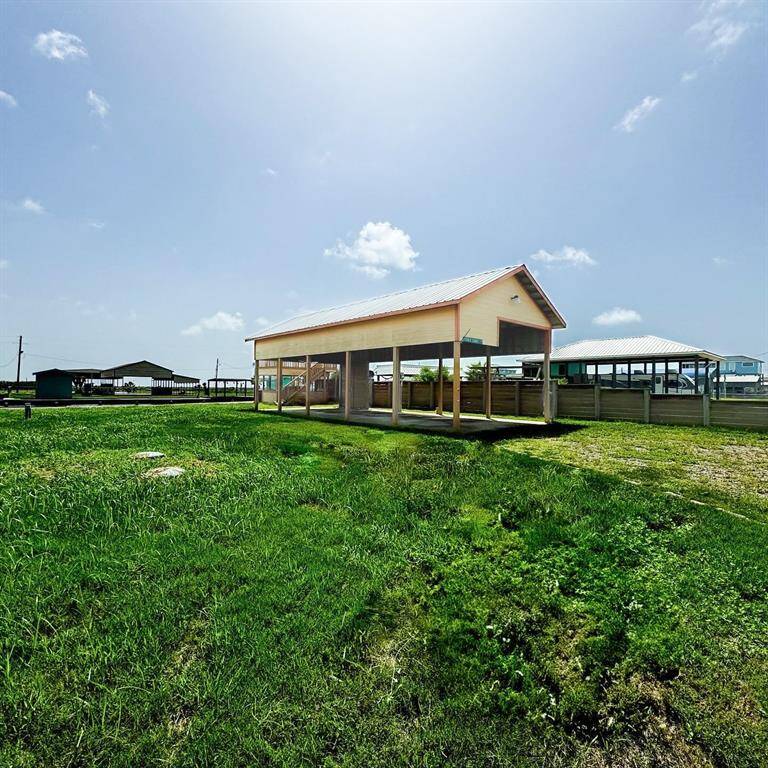 View of the large lot, RV port, with upper and lower deck.