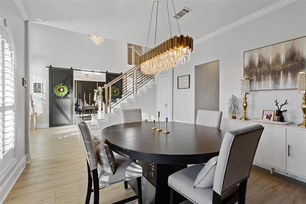 Another view of the formal dining room looking towards the home office. Such unique light fixtures in this house!