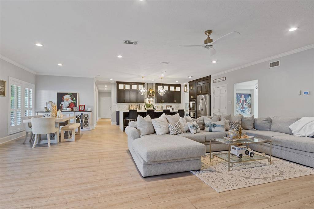 Entertaining will be easy with this open floor plan! Cabinets have been painted a tan color.