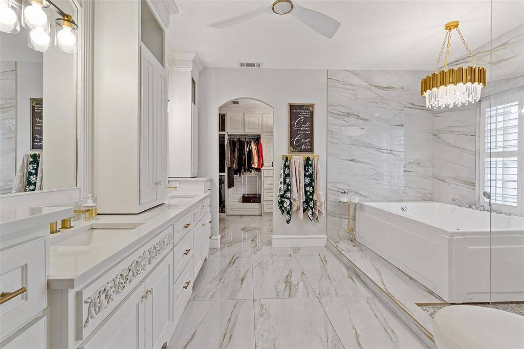 Unwind in your luxurious primary bathroom, the perfect retreat after a busy day.