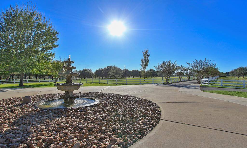A circle driveway gives plenty of room for extra parking. Stunning central fountain!