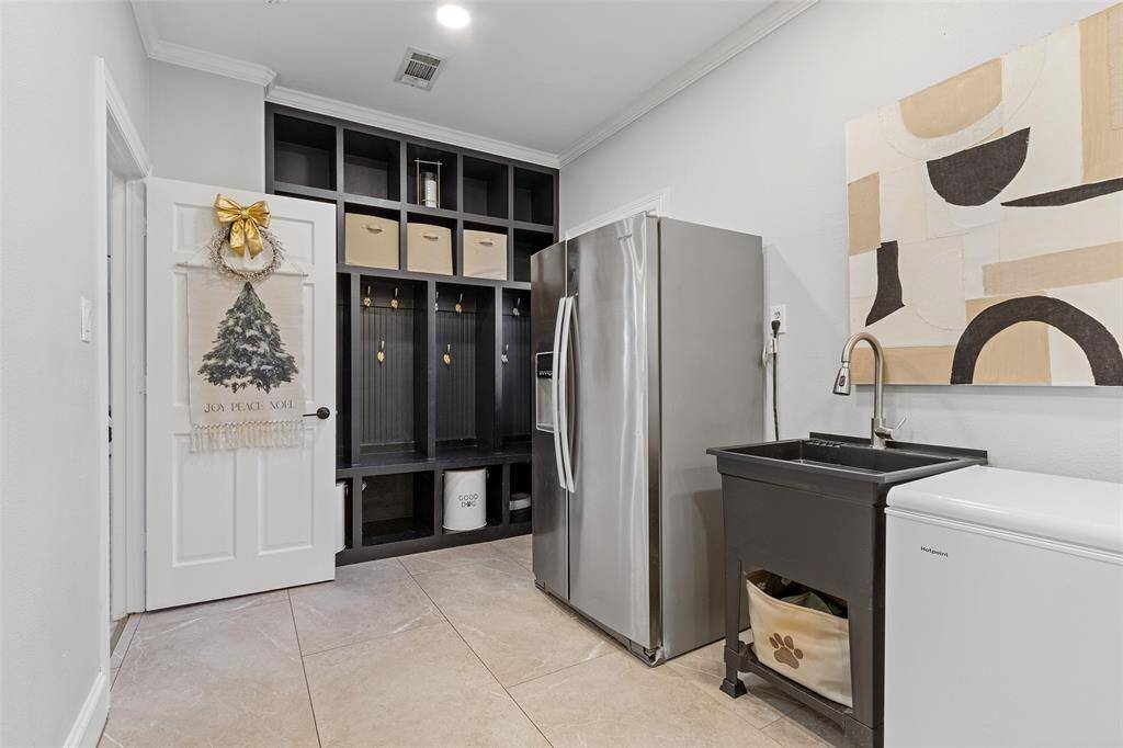 Wow! What a nice utility room and custom built mud room wall.
