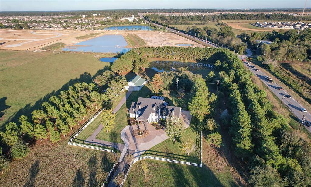 A drone of the property.  Private stocked pond is in the back for the fishers in the family.