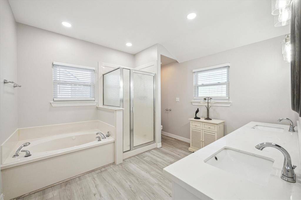 The owner's retreat also offers a huge primary restroom, complete with a jetted tub, separate shower, and a beaufiul double sink with quartz counter tops.