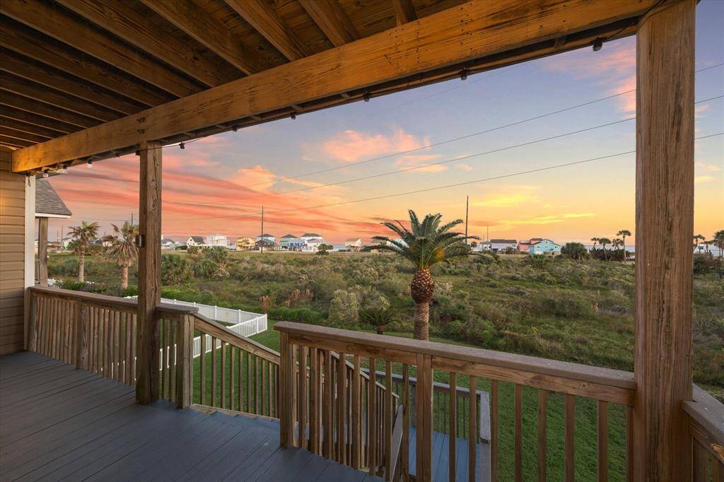 Enjoy your "front" covered porch right off of the living room, with views of the bay and gorgeous sunrises.