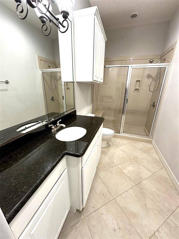 Huge second full bath with large walk in shower and granite counter.does not show the entire closet.