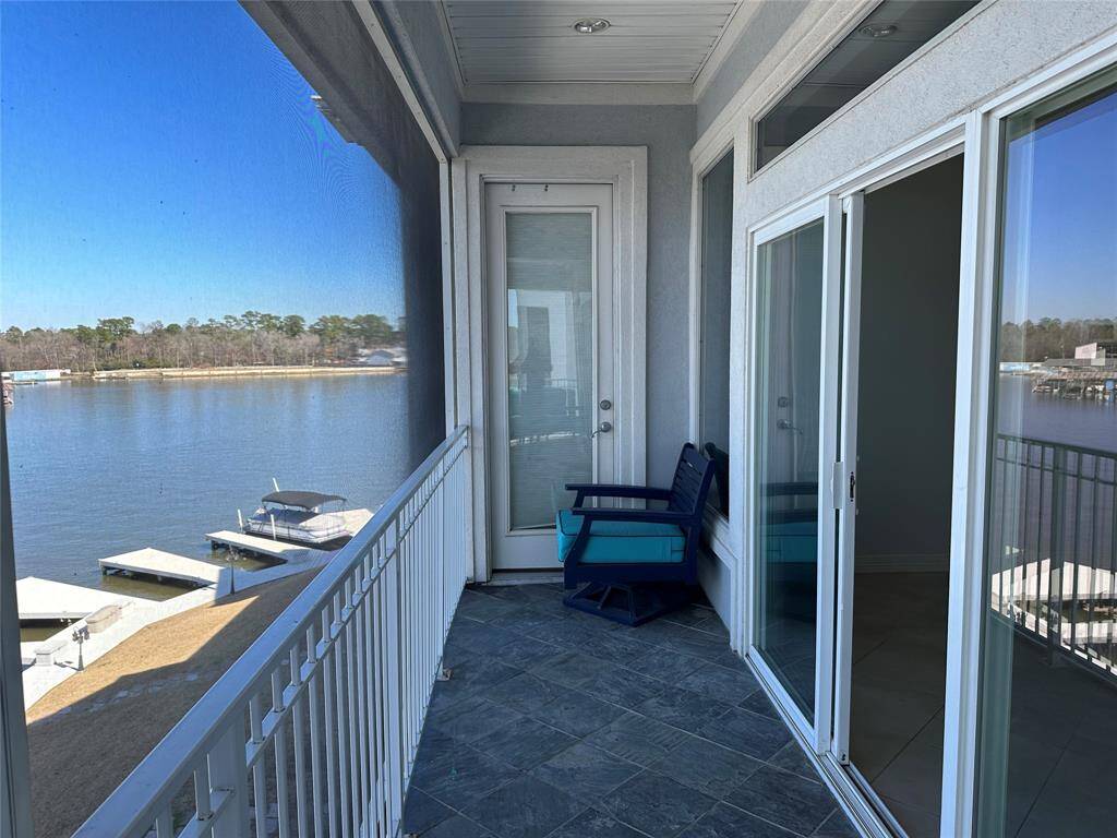 Screened in balcony/patio runs all the way across the back of the condo with access from both bedrooms & family room