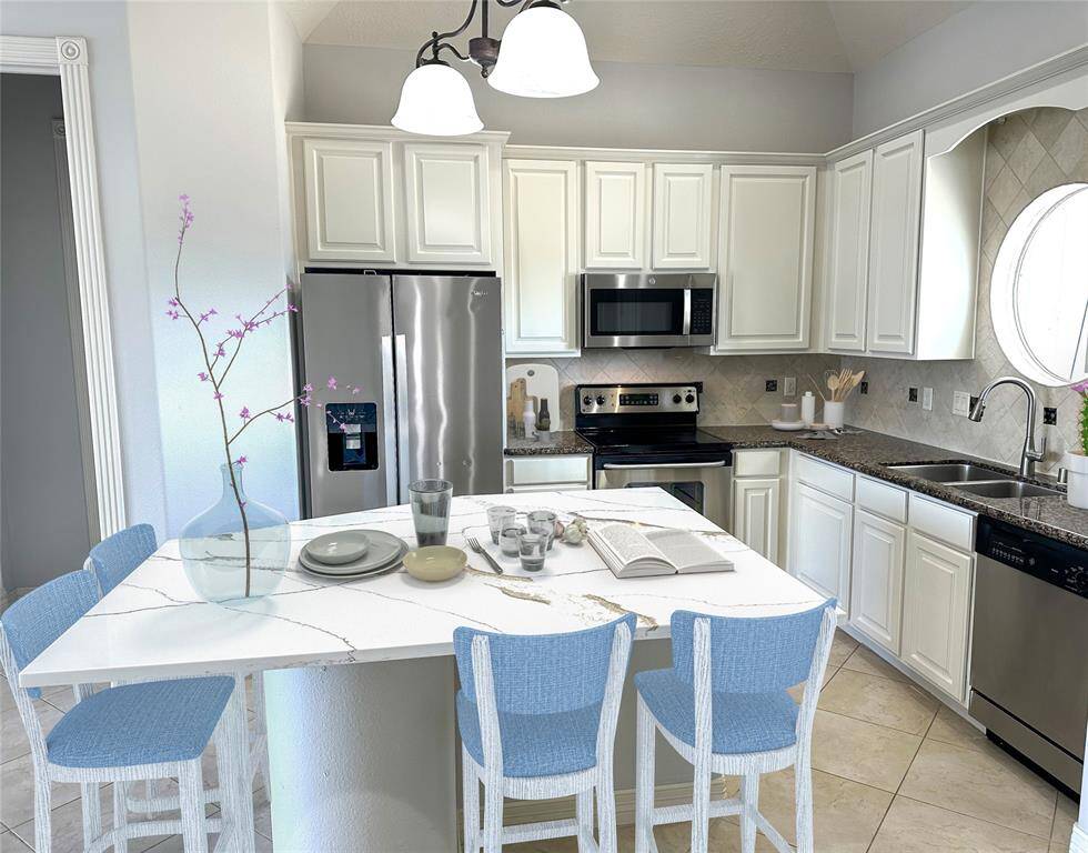 Beautiful kitchen with NEW Quartz island, granite counters, SS appliances, Freshly painted cabinets & walls. virtual staged