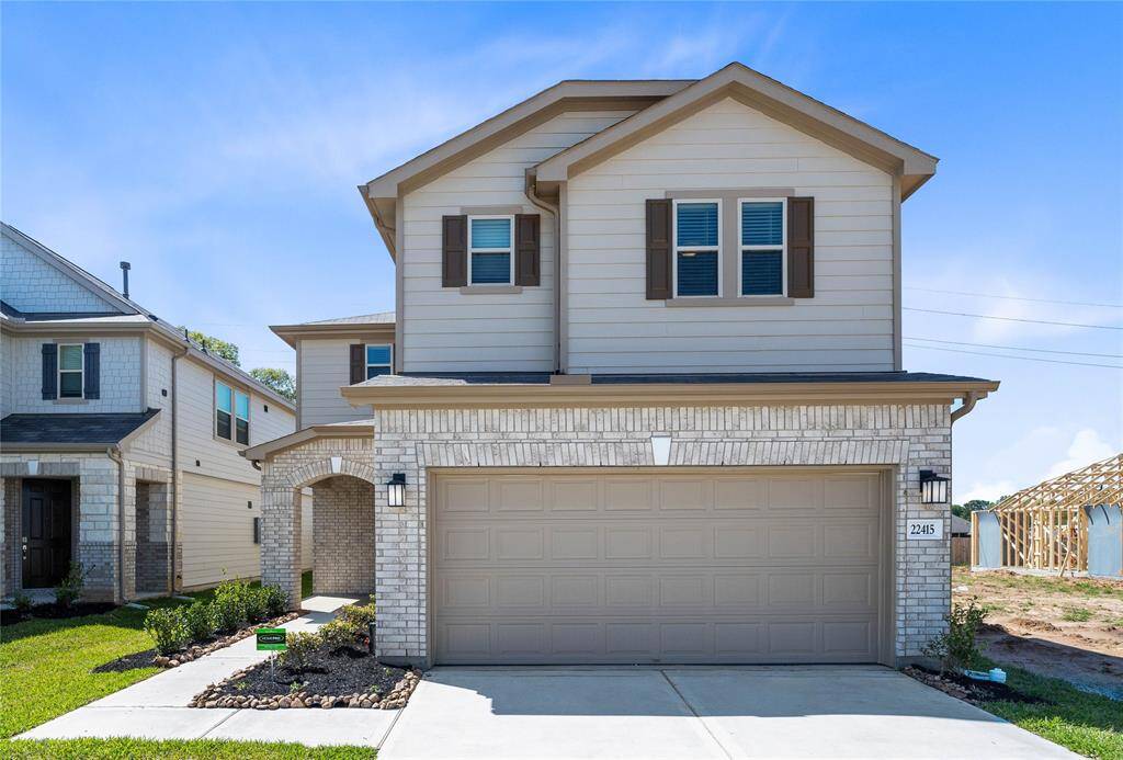 Welcome home to 22415 Hawberry Blossom Lane located in Oakwood Trails zoned to Tomball ISD.
