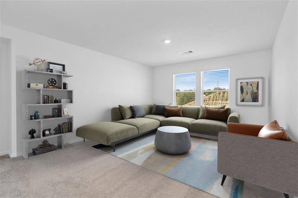 Come upstairs and enjoy a day of leisure in this fabulous loft! This is the perfect hangout spot or adult game room. This space features plush carpet, high ceiling, custom paint, and large windows with blinds!