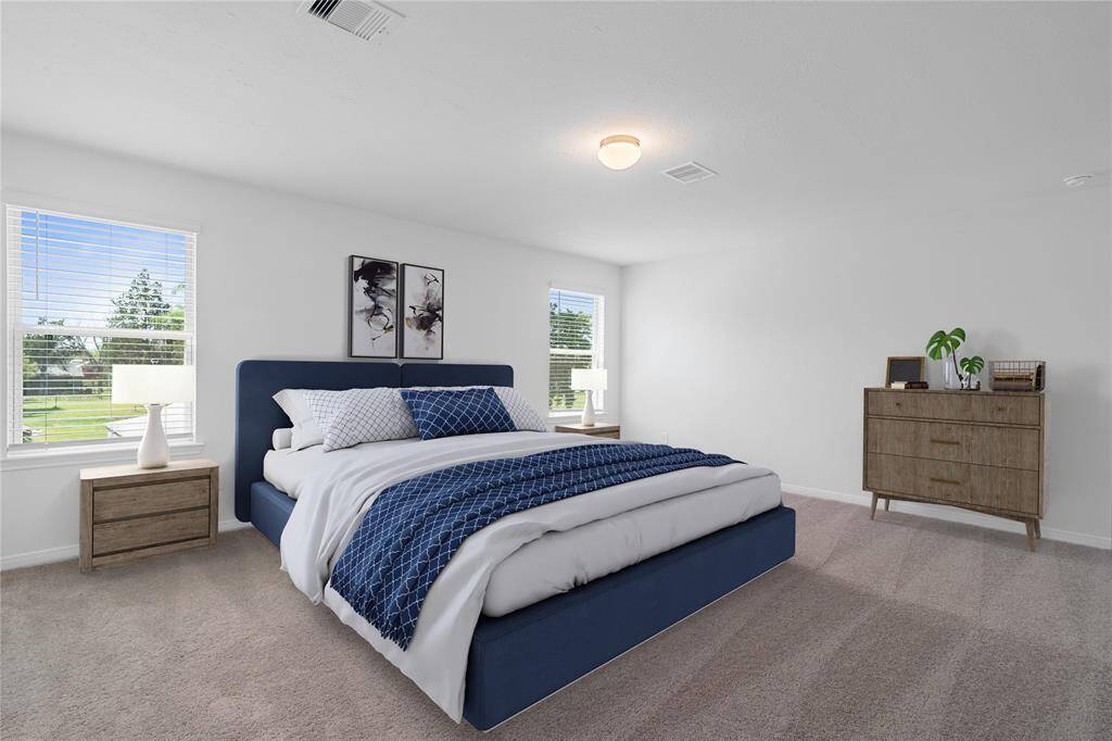 What a wonderful place to come home to, this stunning primary suite greets you with gorgeous plush carpet, custom paint, high ceiling, lighting, and lovely windows allowing in natural light brightening up this spacious primary bedroom!