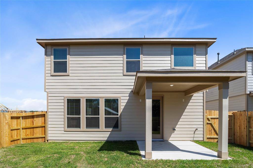 Come and see this spacious backyard with its beautiful covered patio. There is plenty of room for the kids to play and adults to relax!