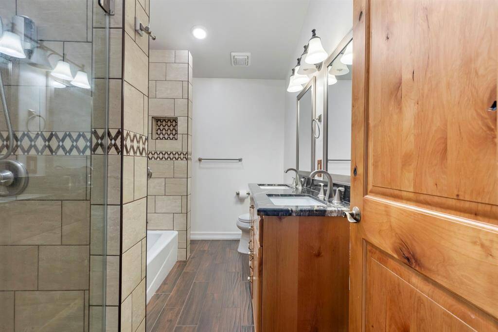 Master bathroom offers a bathtub and separate shower with bidet/toilet