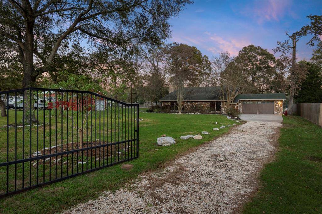 Enter the wrought iron gate to drive up to your new home!