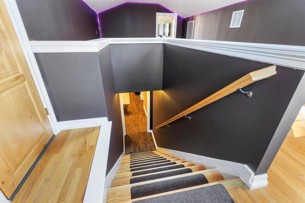 Upstairs to flex space, 3rd bedroom and attic storage space.