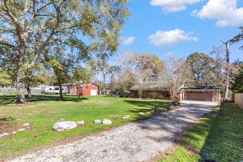 Drive up to your 2 car garage or separate gate and driveway to the shop and tool shed