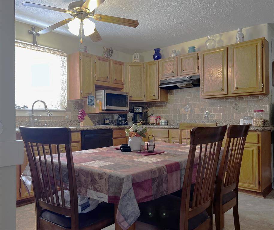 Entering the home, the dining area and kitchen are on the left.