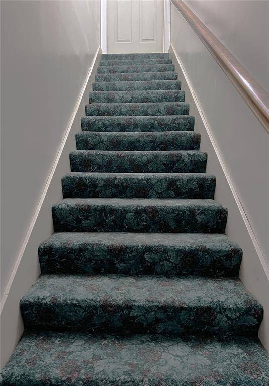 Follow the staircase to 2 bedrooms and another bathroom.