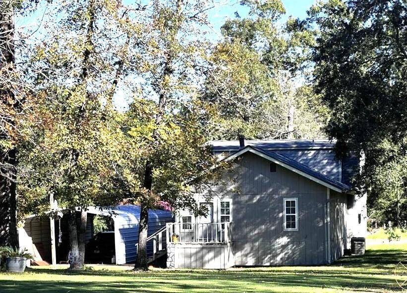 View of the back of the home and carport.
