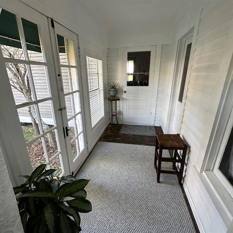 2nd enclosed sunroom located just off the laundry room.
