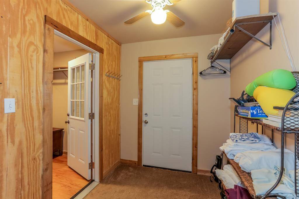 Guesthouse has closet and washer and dryer through those doors all stays with sale of home