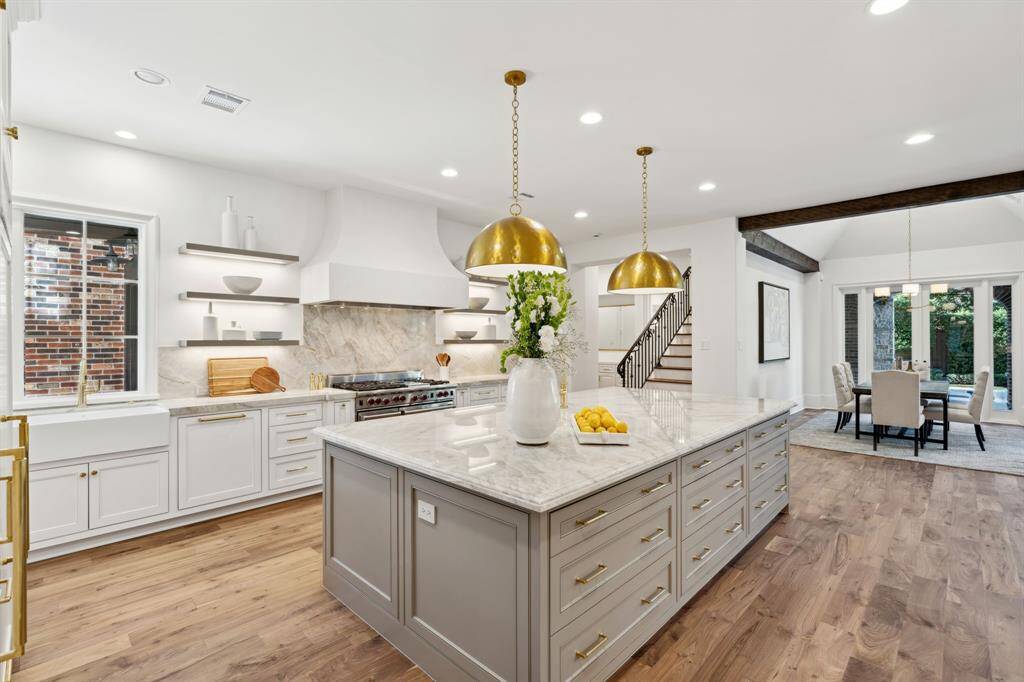 [Kitchen]. Gourmet kitchen with quartzite counters and backsplash.