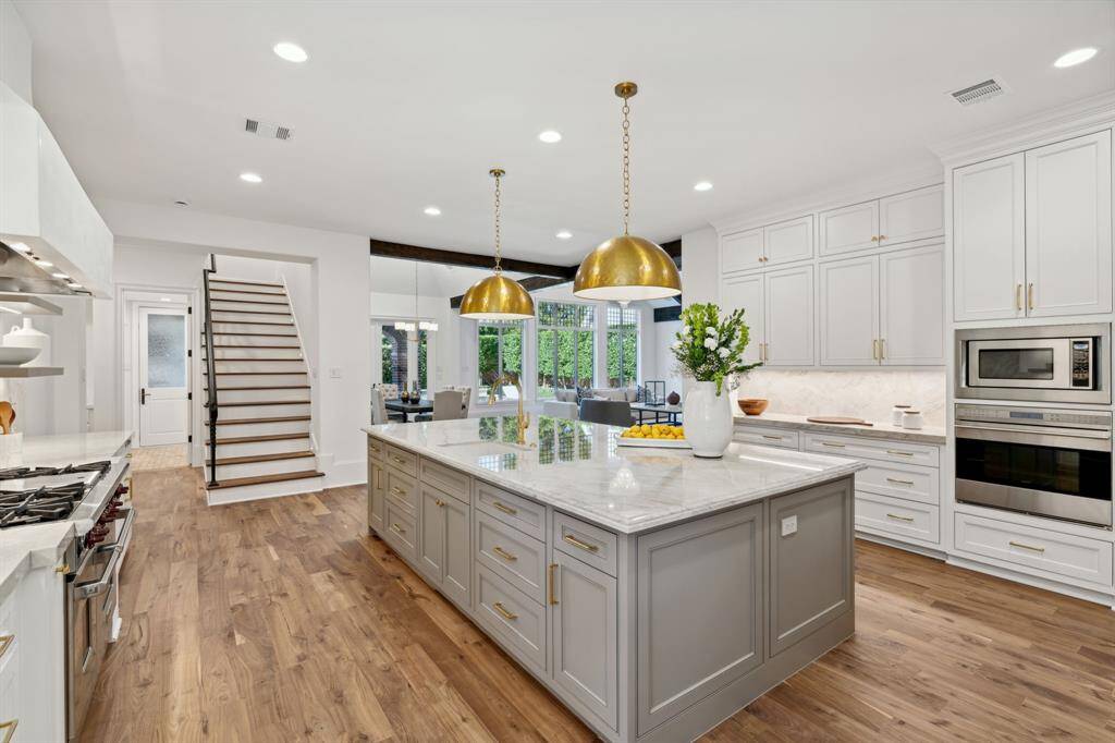 [Kitchen] Another view of the gourmet kitchen with back stairs leading up the primary, office and media room