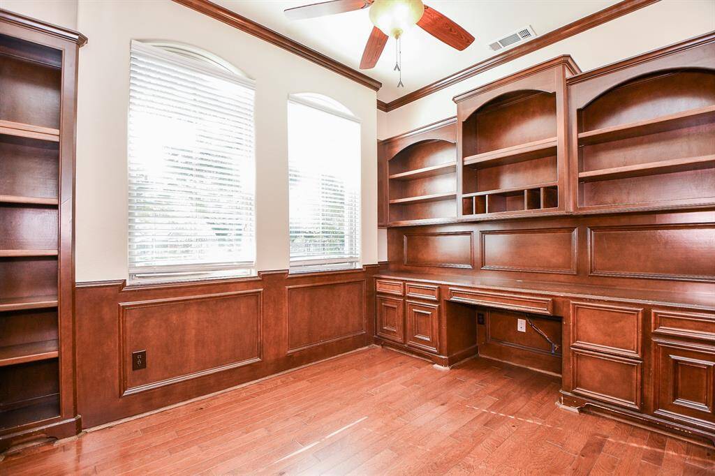 Upstairs game room with built in shelves.