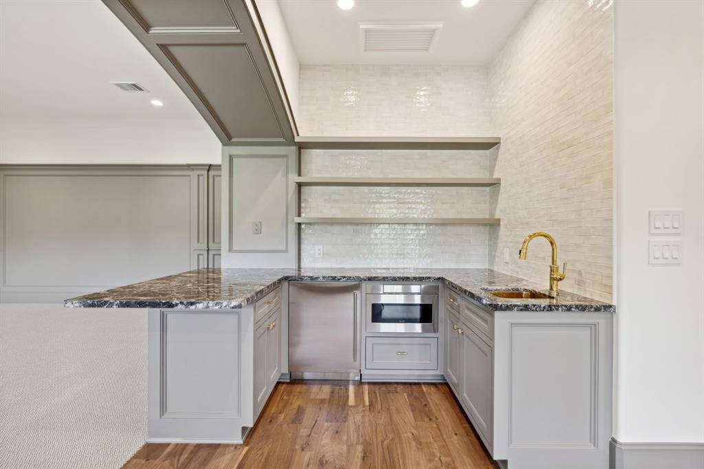 [Media Room]. Beautifully designed beverage center with microwave.  Perfect for a movie and popcorn night!