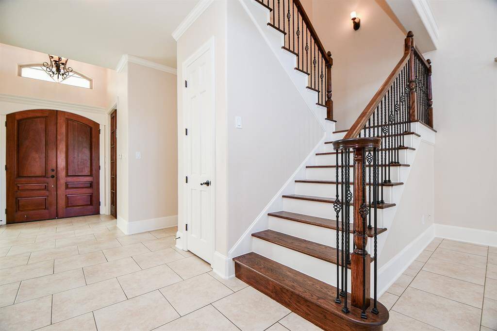 Solid oak stairs to the second floor.