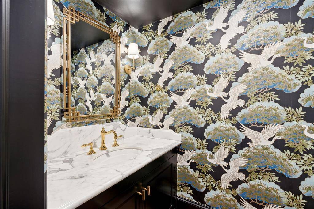 [Half Bath]  Gorgeous half bath with designer wallpaper and gold plumbing fixtures and hardware