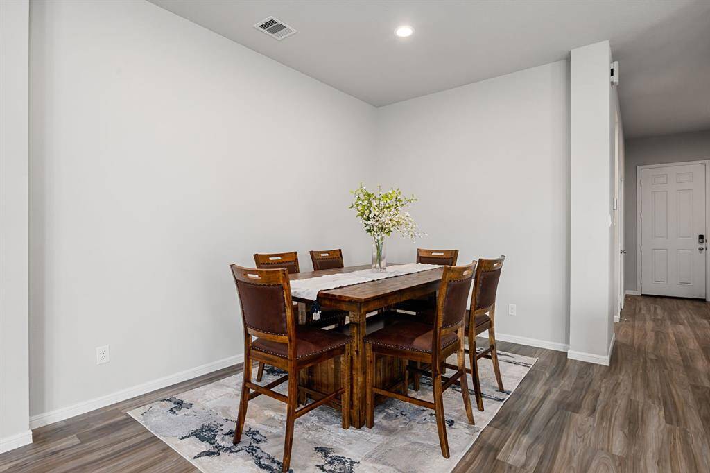 Transform this flexible space into either a formal dining area or a relaxed eating nook. Personalize it with a unique light fixture to match your style!